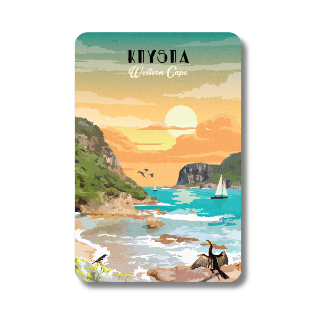 Magnet with a scenic illustration of a coastal landscape, sunset, and sailboat, in Knysna