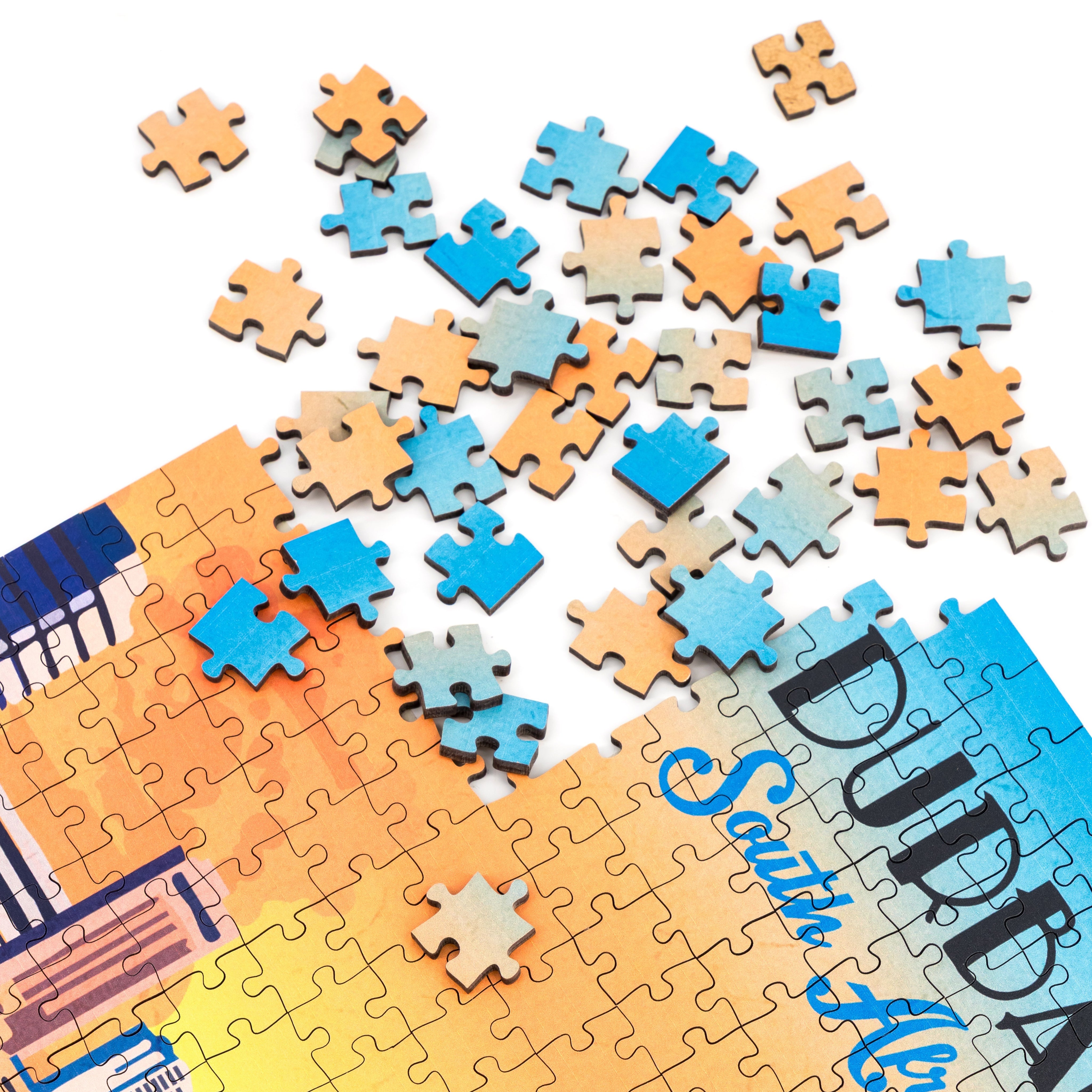 Jigsaw puzzle with partially completed pieces on a white background