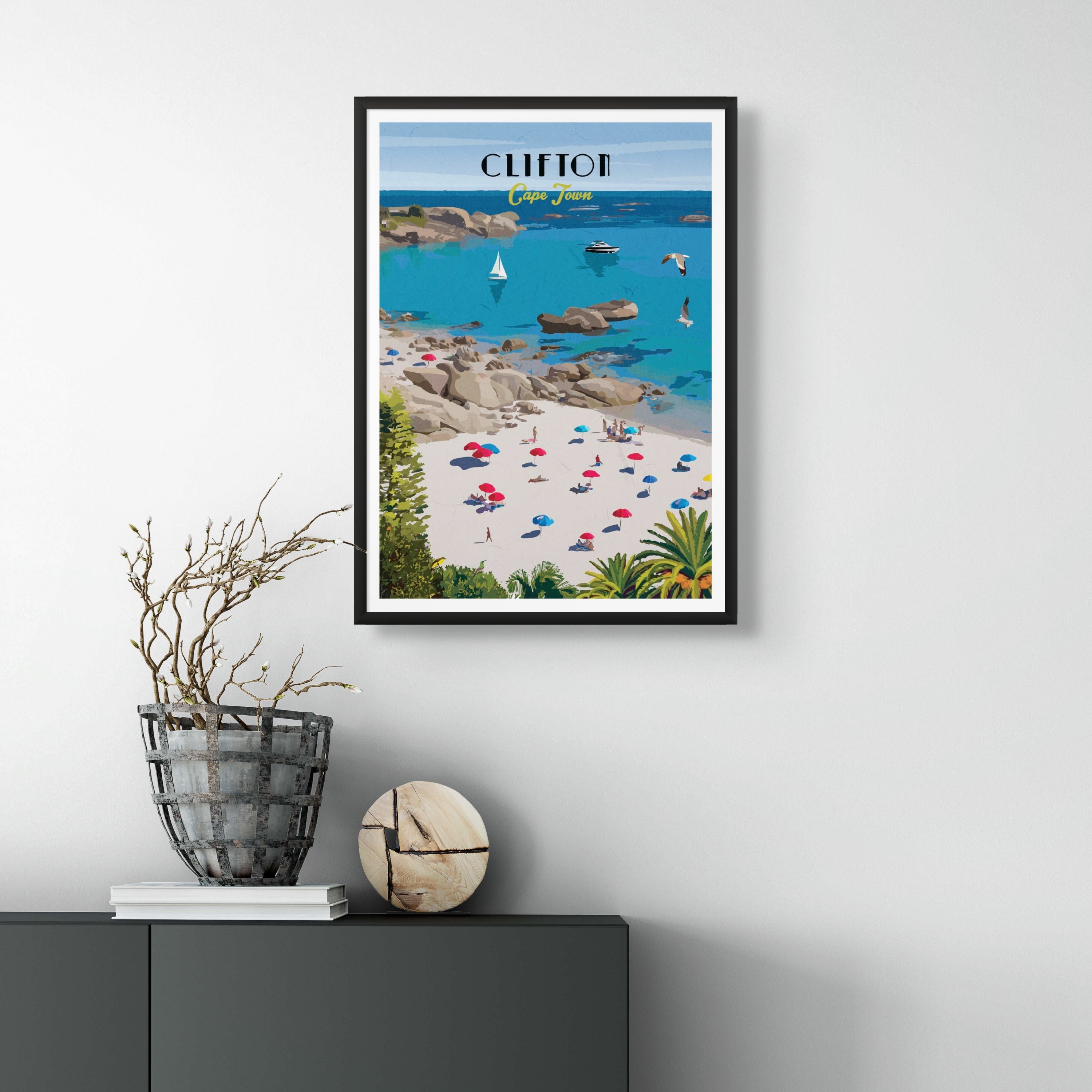 Clifton poster with black frame. Clifton travel poster artwork featuring Cape Town’s iconic beaches and turquoise waters – South African wall art ideal for coastal home decor and beach lovers.