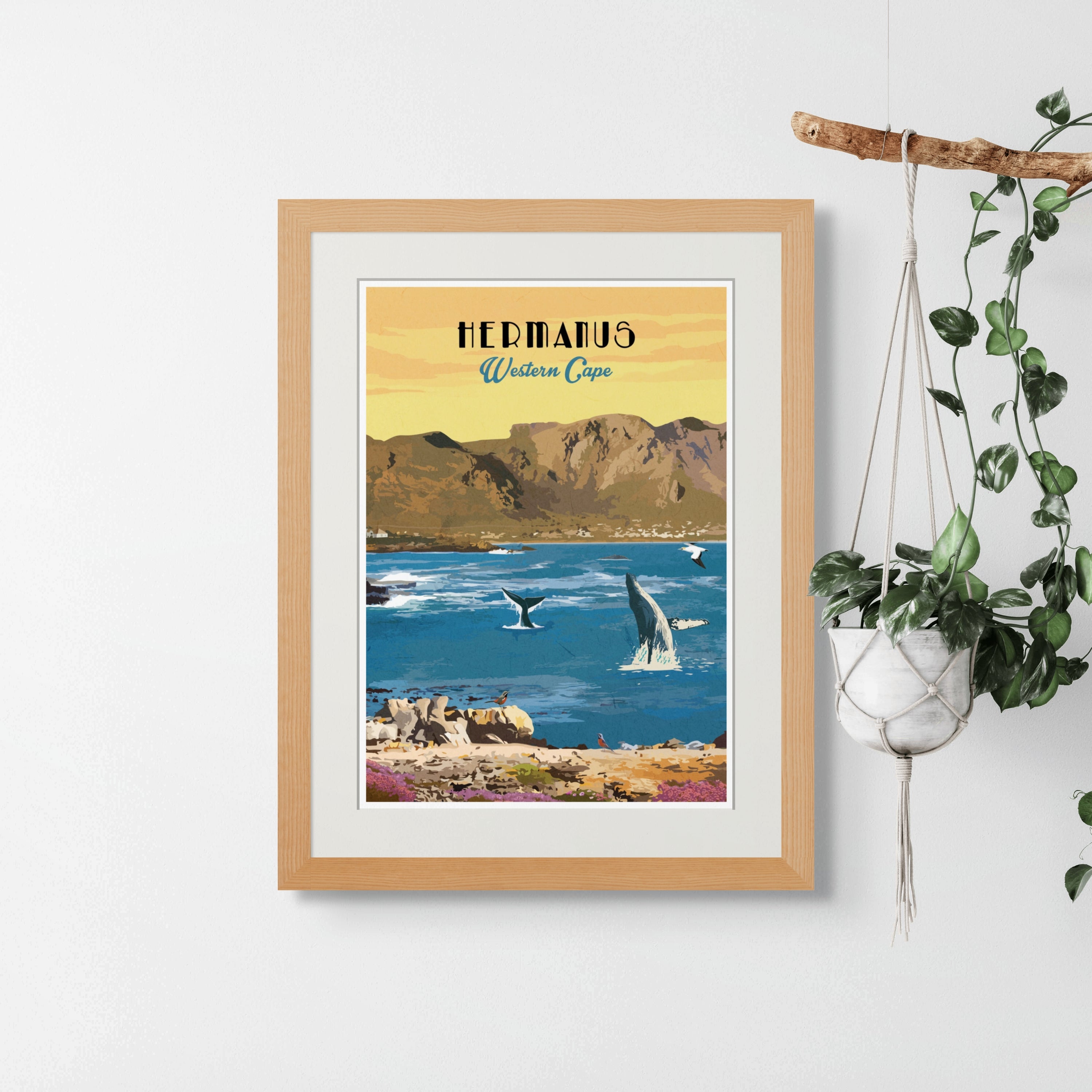 Hermanus with light wood frame. Hermanus art print – illustrated South African coastal poster, perfect for wall art, home decor, and travel-inspired artwork.