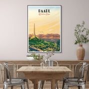Dining room with a wooden table and chairs, featuring a framed poster on the wall.